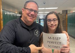  Michael Galli poses for picture with Isabella Bronzovich with 'Perfect M-STEP score' paper
